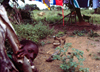 Guinea Bissau / Guin Bissau - Tabanka life: boy playing hide and seek / rapaz a brincar s escondidas (foto de / photo by Dolores CM)