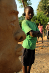 Bissau, Guinea Bissau / Guin Bissau: Bandim quarter, Carnival masks, child and a mask / Bairro Bandim, mscaras de Carnaval, preparao, a criana e mscara - photo by R.V.Lopes