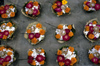 India - Uttaranchal - Rishikesh: ritual offerings for sale - flowers, sugar and incense sticks that will be placed on the Ganges like a miniature boat - photo by W.Allgwer - Zum Verkauf angebotene Opfergaben. In ein groes geformtes Blatt werden Blten