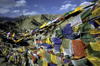 India - Ladakh - Jammu and Kashmir - Leh: prayer flags in the wind - photo by W.Allgwer - Bunte Gebetsfahnen bedruckt mit heiligen Versen und dem Windpferd (Lungta). Die farbliche / symbolische Bedeutung: Rot steht fr Feuer, blau fr Wasser, wei fr Eis