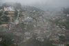 India - Sooty Ooty / Ootacamund / Udagamandalam (TN): town from above, covered in mist - photo by M.Wright