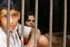 Varanasi / Benares, UP, India: children behind bars - photo by M.Wright