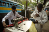 Calcutta / Kolkata, West Bengal, India: street tailor sewing - photo by G.Koelman