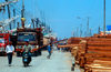 Sunda Kelapa, South Jakarta, Indonesia - timber being unloaded from phinisi boats - old port of Sunda Kelapa - photo by B.Henry