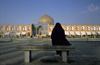 Iran - Isfahan: woman on a bench in Naghsh-i Jahan Square, looking at Sheikh Lotf Allah Mosque at nigh - photo by W.Allgower