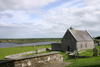 Ireland - Clonmacnoise - County Westmeath: Church and gravestones with a vire of the River Shannon - photo by N.Keegan