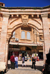 Jerusalem, Israel: Crusader arch at  Suq Aftimos - hospital of the Knights Hospitaller during the crusades - symbol of the Brotherhood of the Holy Sepulchre carved in the center of the arch, Greek T and F, for 'taphos' meaning sepulcher - Muristan, Christian quarter - photo by M.Torres