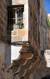 Jerusalem, Israel: closed balcony on corbels - stone masonry oriel window - El Wad Ha Gai street - Muslim Quarter - photo by M.Torres