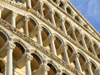 Pisa, Tuscany - Italy: faade of the Duomo, detail of the arches - photo by M.Bergsma