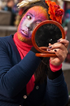 Carnival participant, Iast minute adjustments to make-up, Venice - photo by A.Beaton