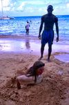 Jamaica - girl buried in the sand (photo by Francisca Rigaud)