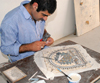 Madaba - Jordan: artisan working on a mosaic - photo by M.Torres
