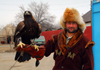 Kazakhstan - Karaturuk area, Almaty province: man with Kazakh hunter clothes and golden eagle - eagle huntsman - photo by M.Torres