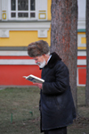 Kazakhstan, Almaty: Holy Ascension Russian Orthodox Cathedral - old Russian man reading a book by Ivan Shamyakin - photo by M.Torres