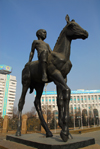 Kazakhstan, Almaty: Republic square - boy on horse - Respublika Alangy - photo by M.Torres