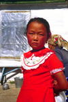 Kazakhstan - Almaty oblys: Kazakh girl wearing a red dress - photo by E.Petitalot