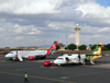 Nairobi, Kenya: Jomo Kenyatta International Airport - control tower - 5H-PAP Udzungwa Precision Air ATR 42-320, cn 363 and 5Y-KYH Kenya Airways Embraer 170 - photo by M.Torres