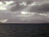 Kerguelen island: a rift in the clouds causes the sun to paint a brilliant line across the sea (photo by Francis Lynch)