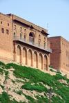 Erbil / Hewler, Kurdistan, Iraq: Erbil Citadel - old brick building with arches and balcony - Qelay Hewlr - UNESCO world heritage site - photo by M.Torres