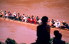 Laos - Luang Prabang - Lao Family watching the annual boats racing in the Mekong River (photo by K.Strobel)