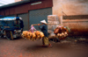 Laos - Vientiane - Man transporting rice baskets - photo by K.Strobel