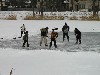 Latvia - Talsi: joys of winter - kids playing ice hockey on a frozen pond (Kurzeme, Kurland region) - photo by A.Dnieprowsky