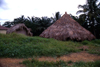 Grand Bassa County, Liberia, West Africa: thatched roof huts - village scene - Africa - photo by M.Sturges