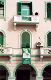 Libya - Tripoli: balconies over Green Square - Khadaffi poster (photo by M.Torres)