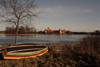 Trakai, Lithuania: Trakai Island Castle and boat resting on the shore of lake Galve - photo by A.Dnieprowsky