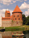 Lithuania / Litva / Litauen - Trakai: Trakai Island Castle - red brick walls - moat - children rowing - photo by J.Kaman