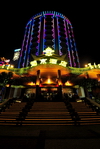 Macau, China: the original Casino Lisboa at night - main entrance and 12-storey round hotel tower - photo by M.Torres