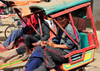 Moramanga, Alaotra-Mangoro, Toamasina Province, Madagascar:  rickshaw 'drivers' wait for clients - pousse-pousse - rikisha - photo by M.Torres