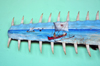 Belo sur Tsiribihina, Menabe Region, Toliara Province, Madagascar: painting on the toothy snout of a sawfish - fishing scene - fishermen set to sea on outrigger canoes - Malagasy art - Pristis microdon - photo by M.Torres