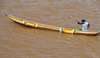 Tsimafana, Belo sur Tsiribihina,  Menabe Region, Toliara Province, Madagascar: man rowing on a dugout canoe - photo by M.Torres