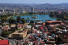 Antananarivo / Tananarive / Tana - Analamanga region, Madagascar: view from the Haute Ville - the heart shaped Anosy Lake with its War Memorial at the end of a causeway - panoramic view of downtown - photo by M.Torres