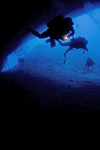 Sipadan Island, Sabah, Borneo, Malaysia: divers entering Turtle Tomb - photo by S.Egeberg