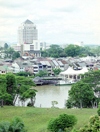 Malaysia - Kuching - Sarawak (Borneo): old and new skylines - view from Fort Margherita (now the Police Museum) across the Sarawak River (photo by Rod Eime)