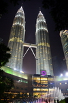 Kuala Lumpur, Malaysia: Petronas Towers and Suria KLCC shopping mall at night, from KLCC Park - designed by Cesar Pelli and inaugurated in 1998 - photo by M.Torres