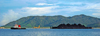 towboat towing a barge transporting coal, Pulau Pangkor Island, Malaysia. photo by B.Lendrum