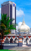 Masjid Jamek mosque and the Bank of Commerce building - city center, Kuala Lumpur, Malaysia - photo by B.Lendrum