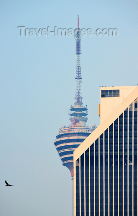 mal92: Kuala Lumpur, Malaysia: KL Tower behind Maybank Tower (Menara Maybank), bird of prey - Pudu - photo by M.Torres - (c) Travel-Images.com - Stock Photography agency - Image Bank