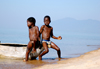 Kandy Bay, Lake Nyasa, Malawi: children sit on a canoe - photo by D.Davie