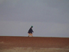 Mali - River Niger: a lone walker on the sandy banks - photo by A.Slobodianik