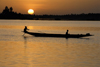 Mopti, Mali: canoe silhouette on the Niger river at sunset - photo by J.Pemberton