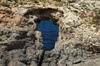 Malta - Comino: pierced rock - hole (photo by A.Ferrari)