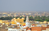 Nouakchott, Mauritania: skyline of the sprawling Moor capital - buildings,  minaret, the palm trees of the 'Jardins de Nouakchott' and the coast-line - photo by M.Torres