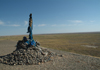 Mongolia - Gobi desert: oovo and the emptiness - Buddhist cairn - small shrine in the middle of the desert - shamanistic rock cairn - photo by A.Summers