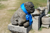 Karakorum, central Mongolia: Erdene Zuu monastery, Kharkhorin - lion statue with a scarf - photo by A.Ferrari