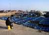 Morocco / Maroc - Mogador / Essaouira: womam waiting for the fishermen's return (photo by J.Kaman)