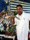Morocco / Maroc - Mogador / Essaouira: meet the fishmonger and his friend - photo by J.Kaman